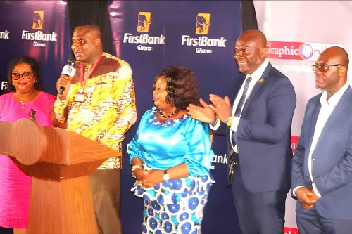  Franklin Sowa (2nd from left), Director, Marketing and Sales of GCGL, and Hannah Acheampong Amoah  (left), Editor, Junior Graphic, launching the Junior Graphic National Essay Competition. With them are Theresa Tetteh (middle), Municipal Director of Education, Ledzokuku Teshie; Enoch Vanderpuye (2nd from right), Country Team Lead, Marketing and Corporate Communications, FirstBank Ghana, and Samuel Essel (right), Director, Finance & Admin, GCGL Picture: ESTHER ADJORKOR ADJEI 