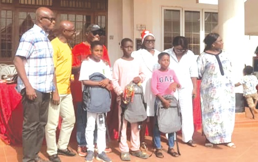 Kofi Amoa-Awuah (2nd from left), Chairman of Adjiringanor North Motorway Area Residents Association, and other members of the association after presenting awards to some of the children at the event Kofi Amoa-Awuah (2nd from left), Chairman of Adjiringanor North Motorway Area Residents Association, and other members of the association after presenting awards to some of the children at the event