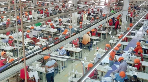 Workers on a manufacturing floor Workers on a manufacturing floor