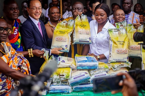 Justina Marigold Assan (arrowed), former Regional Minister, unveiling the Central Agra rice