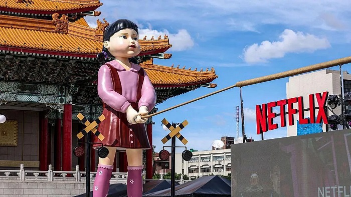 A giant killer doll, among other motifs of Squid Game, were part of a parade celebrating the show's final season A giant killer doll, among other motifs of Squid Game, were part of a parade celebrating the show's final season