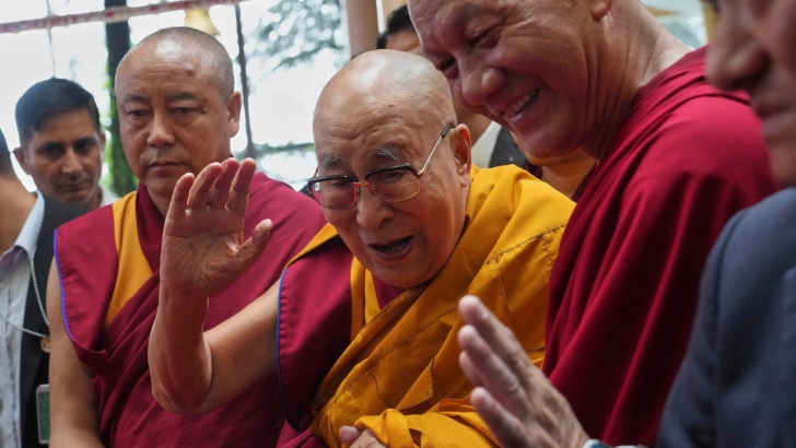 The Dalai Lama, centre, greets people as he arrives at an event a day before his 90th birthday. Pic: AP/Ashwini Bhatia Dalai Lama hopes to live beyond 130 years, much longer than predicted