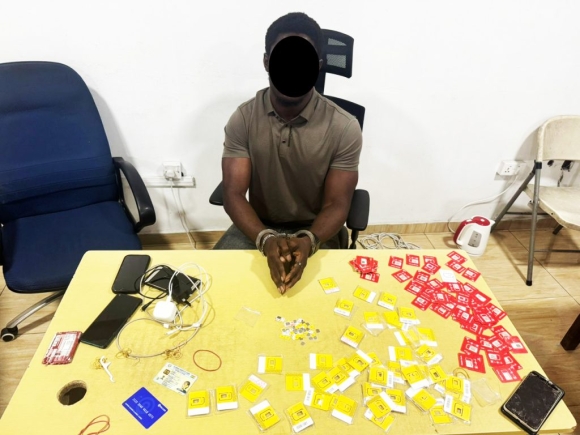 Jesper Kobina Mensah, the accusedd with some SIM cards and others used in committing the allaged crime