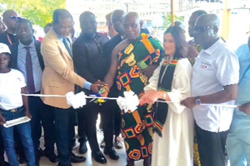 The new National Cleft Care Centre at the Komfo Anokye Teaching Hospital, INSET: Nana Prof. Oheneba Boachie-Adjei Woahene II, Otumfuo Hiahene, with Susannah Schaefer (2nd from right), President, Smile Train, and other dignitaries cutting the tape to inaugurate the new centre 