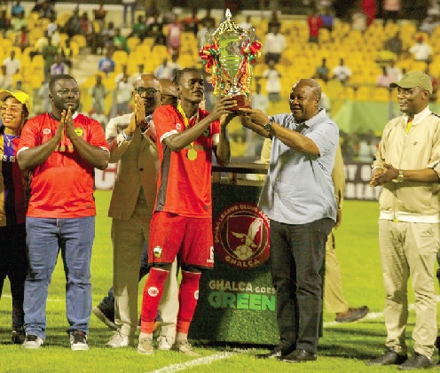 • President John Dramani Mahama (2nd from right) presenting the President's Cup trophy to Samba O’Neil, Kotoko’s captain, while Kofi Adams (right), Minister of Sports and Recreation, and Dr Frank Amoakohene (2nd from left), Ashanti Regional Minister, look on. Picture: Caleb Vanderpuye • President John Dramani Mahama (2nd from right) presenting the President's Cup trophy to Samba O’Neil, Kotoko’s captain, while Kofi Adams (right), Minister of Sports and Recreation, and Dr Frank Amoakohene (2nd from left), Ashanti Regional Minister, look on. Picture: Caleb Vanderpuye