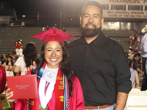 Arias-Cristobal poses with her father Jose Francisco Arias-Tovar after graduating from Dalton High School in May 2024. Student faces deportation after running red light — police discover her entire family has been living illegally in US