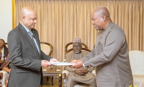 President John Mahama (right) accepting the credentials of Conrad Vincent Mederic, High Commissioner of The Republic of Seychelles
