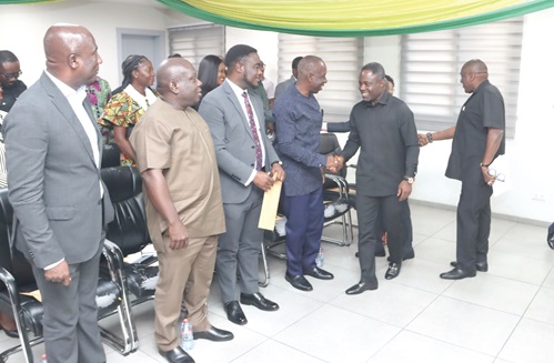 Kwabena Mintah Akandoh (2nd from right), Minister of Health, congratulating the newly inaugurated members of the boards. Picture: ELVIS NII NOI DOWUONA 