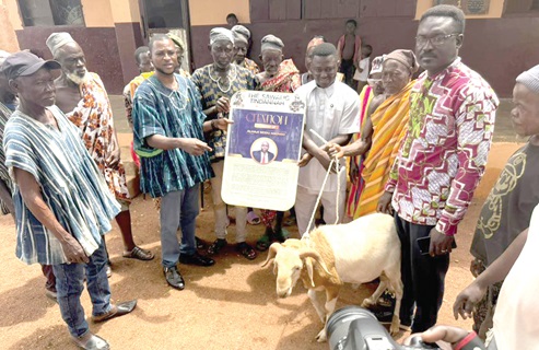 Solomon Zinekena (3rd from left), youth leader of Talensi, staff of Sawaliga School and community leaders presenting a citation and a ram to Alhaji Seidu Agongo
