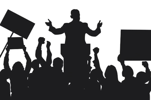 A silhouette of a democratic leader speaking to protesters A silhouette of a democratic leader speaking to protesters
