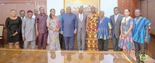 President John Mahama (7th from right) with Board Members and some officials of PIAC at the Jubilee House