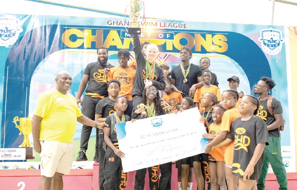 Officials and members of the Dolphin team celebrating with their prizes Officials and members of the Dolphin team celebrating with their prizes