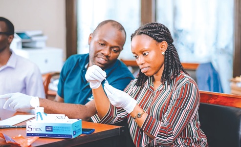 Laboratory scientists working during one of the pilot screening exercises to roll out the initiative