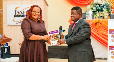 Prof. Peter Quartey (right), Director, ISSER, presenting the newly launched Ghana Social Development Outlook Report 2024 to Mary Awelana Addah, Executive Director, Ghana Integrity Initiative Prof. Peter Quartey (right), Director, ISSER, presenting the newly launched Ghana Social Development Outlook Report 2024 to Mary Awelana Addah, Executive Director, Ghana Integrity Initiative