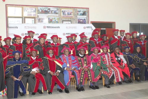 Dignitaries, members of faculty and graduates after the graduation ceremony.