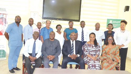 Professor Ahmed Jinapor (seated middle), Director-General of the Ghana Tertiary Education Commission, with management of the Family Health University Professor Ahmed Jinapor (seated middle), Director-General of the Ghana Tertiary Education Commission, with management of the Family Health University