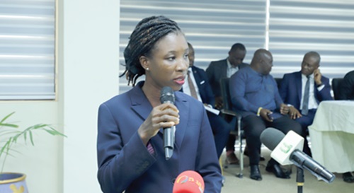 Evelyn Asamoah (left), a High Court Judge, swearing in board members of the Greater Accra Regional Lands Commission
