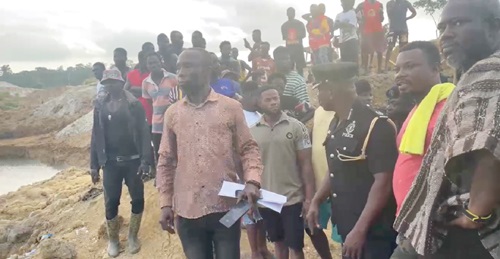 Umar Ahmed (arrowed), DCE for Denkyembour, the police and some town folk arriving at the galamsey site where over 20 illegal miners were trapped Umar Ahmed (arrowed), DCE for Denkyembour, the police and some town folk arriving at the galamsey site where over 20 illegal miners were trapped