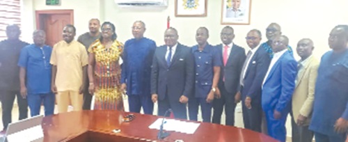 Dr Clement Apaak (6th from left), Deputy Education Minister, and Samuel Kembou (7th from left) of the Jacobs Foundation with members of the committee after the opening session of the first meeting