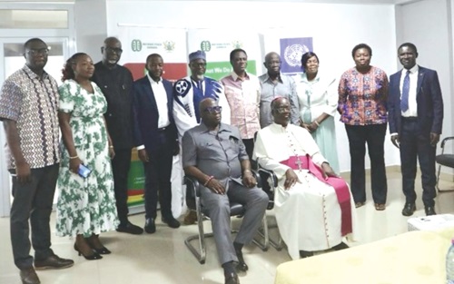 Ebenezer Okletey Terlabi (seated left), Deputy Minister for the Interior, and Most Rev. Emmanuel Kofi Fianu (seated right), Chairman, Governing Board, NPC, with other members of the board Ebenezer Okletey Terlabi (seated left), Deputy Minister for the Interior, and Most Rev. Emmanuel Kofi Fianu (seated right), Chairman, Governing Board, NPC, with other members of the board