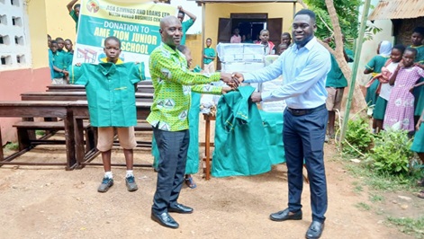 Alfred Sika (right), Kukuo Branch Manager of ASA, presenting the items to Alhassan Abdulai Halidu, Headmaster of A.M.E Zion Primary School Alfred Sika (right), Kukuo Branch Manager of ASA, presenting the items to Alhassan Abdulai Halidu, Headmaster of A.M.E Zion Primary School