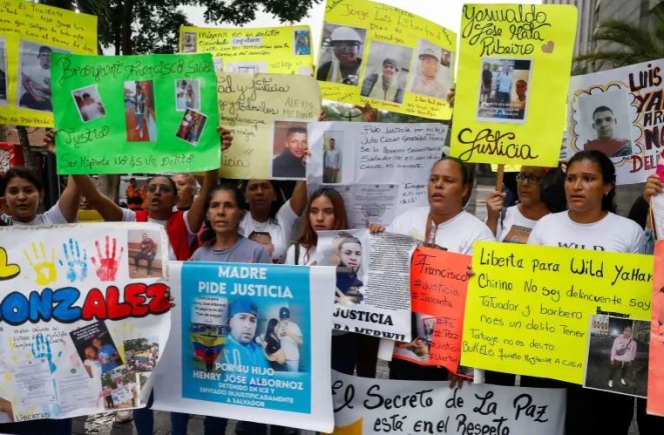 Family members of Venezuelan migrants held in El Salvador's Terrorism Confinement Center (CECOT) prison protest outside the United Nations building in Caracas on April 22 [Leonardo Fernandez Viloria/Reuters]