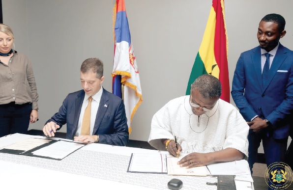 • Kofi Iddie Adams (right), Minister for Sports and Recreation, and Marko Đurić, Serbia’s Minister for Foreign Affairs, signing the agreement • Kofi Iddie Adams (right), Minister for Sports and Recreation, and Marko Đurić, Serbia’s Minister for Foreign Affairs, signing the agreement