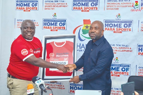 •Dr Eric Kwame Adae (left) presenting the customised jersey to Mr Samson Deen •Dr Eric Kwame Adae (left) presenting the customised jersey to Mr Samson Deen