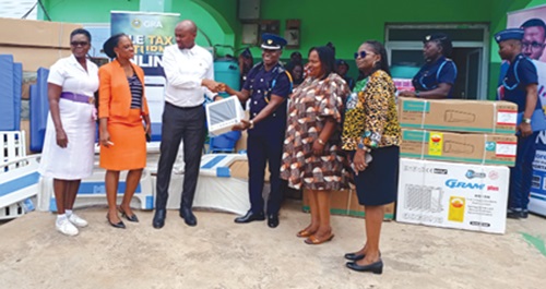 Philip Timbilla (3rd from right), Deputy Tema Sector Commander of the Customs Division of Ghana Revenue Authority, handing over the items to Dr Joseph Donkor, Medical Superintendent, Tema Manhean Polyclinic Philip Timbilla (3rd from right), Deputy Tema Sector Commander of the Customs Division of Ghana Revenue Authority, handing over the items to Dr Joseph Donkor, Medical Superintendent, Tema Manhean Polyclinic