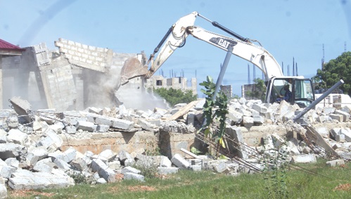 A structure being demolished at the site. Picture: ESTHER ADJORKOR ADJEI A structure being demolished at the site. Picture: ESTHER ADJORKOR ADJEI