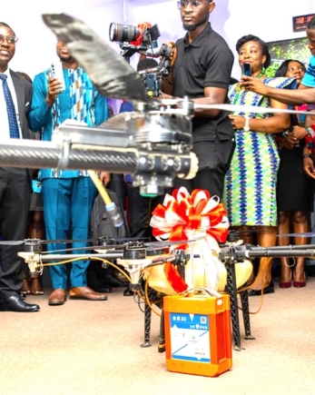 An official of the E-Learning Centre, flying a drone.