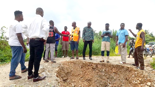 Joshua Yaw Frederick (middle), District Chief Executive for Ayensuano, together with personnel from the National Disaster Management Organisation assessing the extent of damage