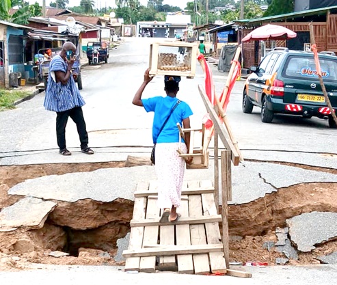 A hawker using a temporary bridge 