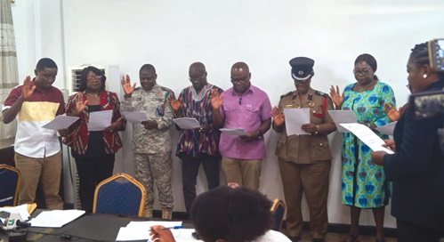 Members of the Central Regional Disaster Management Committee being sworn into office Members of the Central Regional Disaster Management Committee being sworn into office