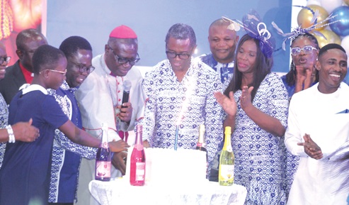 Right Rev. Michael Agyarkwa Bossman (3rd from left), the immediate past Administrative Bishop of the Methodist Church of Ghana, being assisted by Kobina Yeboah Okyere (2nd from left), the National Director of Compassion International Ghana; Reverend Philip Kofi Tutu (3rd from right), Chairman of the Governing Council of Compassion International Ghana, and other members of the organisation as they cut the anniversary cake. Picture: ESTHER ADJORKOR ADJEI Right Rev. Michael Agyarkwa Bossman (3rd from left), the immediate past Administrative Bishop of the Methodist Church of Ghana, being assisted by Kobina Yeboah Okyere (2nd from left), the National Director of Compassion International Ghana; Reverend Philip Kofi Tutu (3rd from right), Chairman of the Governing Council of Compassion International Ghana, and other members of the organisation as they cut the anniversary cake. Picture: ESTHER ADJORKOR ADJEI