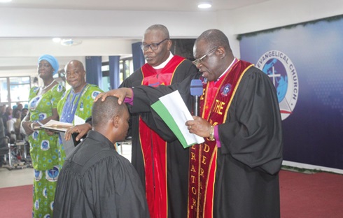 Rt. Rev. Samuel Prosper Dzomeku (right), Moderator of the Global Evangelical Church, and Dr Yohanes K. Ahiabu (left), the Synod Clerk of the church, laying hands on a newly commissioned Minister Rt. Rev. Samuel Prosper Dzomeku (right), Moderator of the Global Evangelical Church, and Dr Yohanes K. Ahiabu (left), the Synod Clerk of the church, laying hands on a newly commissioned Minister
