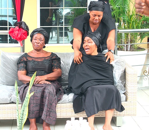 Priscilla Ofori Fosu (seated right), wife of the late Daddy Lumba, being consoled as she weeps. Picture: ERNEST KODZI