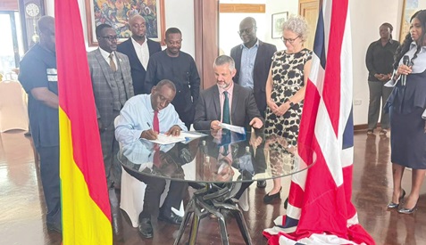 Kofi Addo (left), Chief Commercial Officer at the Ministry of Trade, Agribusiness and Industry, signing the agreement with Richard Sandall, Development Director of the British High Commission in Accra