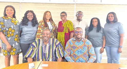 Dr Doli-Wura Zakaria (seated left), MD of NIB and Alexander Quarcoopome (seated right), CEO of Nexans Kabelmetal Ghana Ltd, with some staff of Nexans 