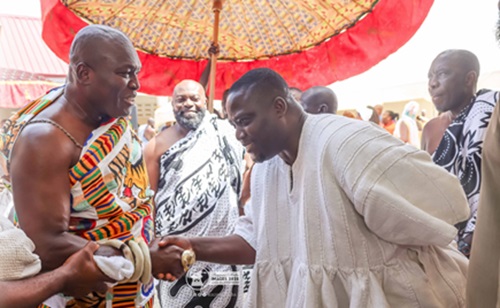 Odeheno Kwafo Akoto III (left), Omanhene of the Akwamu Traditional  Area, in a hand shake with Clemence Gyato, Consultant to the Ministry of Lands and Natural Resources