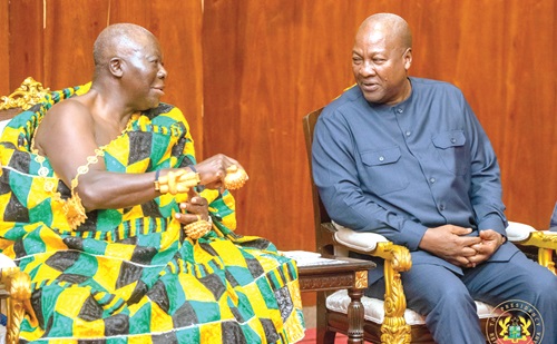 Asantehene, Otumfuo Osei Tutu II (left), in discussions with President John Mahama in the meeting