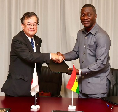 Ambassador Ramses Joseph Cleland (right), Chief Director of the Ministry exchanging documents with H.E. Yoshimoto Hiroshi, Japanese Ambassador to Ghana Ambassador Ramses Joseph Cleland (right), Chief Director of the Ministry exchanging documents with H.E. Yoshimoto Hiroshi, Japanese Ambassador to Ghana