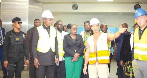 A contructor (hand stretched) explaining the level of work to Joseph Bukari Nikpe (2nd from left), Minister of Transport, while Yvonne Nana Afriyie Opare (middle), MD, GACL, and other officials look on A contructor (hand stretched) explaining the level of work to Joseph Bukari Nikpe (2nd from left), Minister of Transport, while Yvonne Nana Afriyie Opare (middle), MD, GACL, and other officials look on