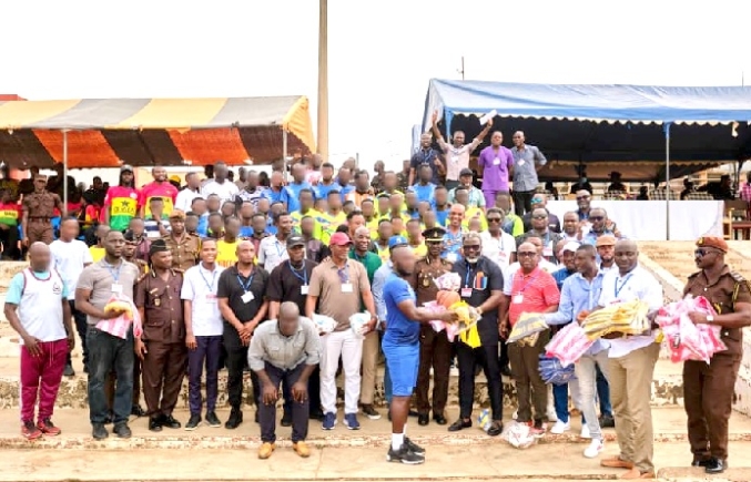 Kwesi Nyantakyi (4th from right) and Samuel Osei Kuffour, PFAG President, handing over football gear to an inmate representative, flanked by football legends and prison officials Kwesi Nyantakyi (4th from right) and Samuel Osei Kuffour, PFAG President, handing over football gear to an inmate representative, flanked by football legends and prison officials