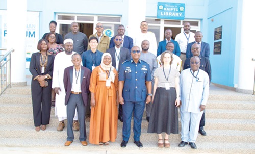 Air Commodore David Akrong (middle), acting Commandant, Prof. Campbell (2nd from right) and Prof. Kwesi Anning (right) with the researchers and experts