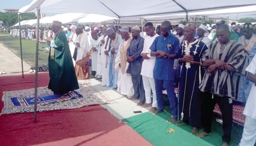 Alhaji Adam Fuseini (left), Deputy Tema Metropolitan Chief Imam, leading the Muslim worshipers in prayers during the Eid festival