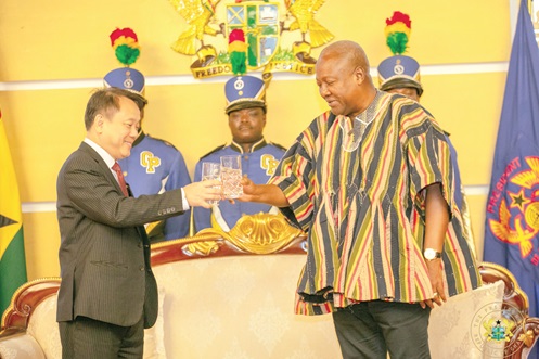 President Mahama proposing a toast with Bui Quoc Hung, Ambassador of the Republic of Vietnam
