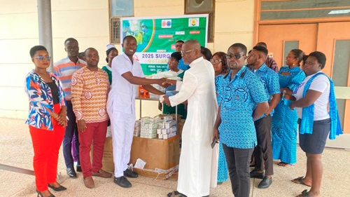 Bro. Rev. Fr. Alex Awuah (2nd from right), Chaplain of the St Michael’s Marshallan Association, making a presentation to Welbek Asamoah, Head of Nursing at the hospital Bro. Rev. Fr. Alex Awuah (2nd from right), Chaplain of the St Michael’s Marshallan Association, making a presentation to Welbek Asamoah, Head of Nursing at the hospital