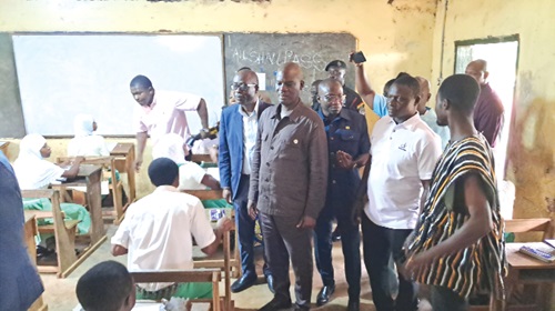 Haruna Iddrisu (2nd from left), Minister of Education, at an examination centre in Techiman
