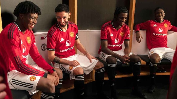 Bruno Fernandes (2nd from left) and teammates model the new kit. Manchester United Bruno Fernandes (2nd from left) and teammates model the new kit. Manchester United